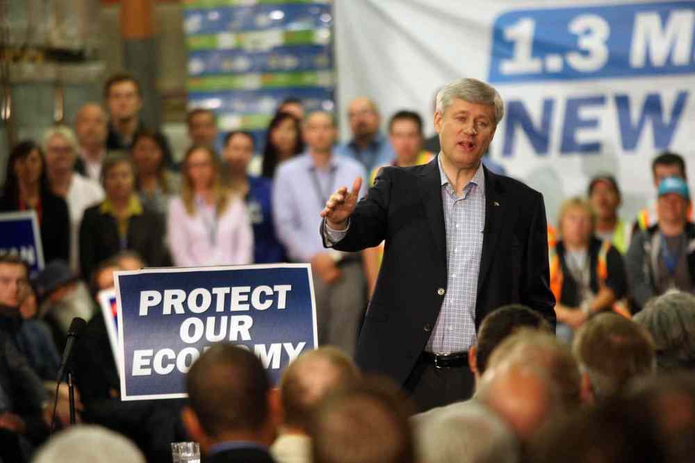 JOE BRYKSA / WINNIPEG FREE PRESS
Prime Minister Stephen Harper, at the Bison Transport warehouse on Wellington Avenue in Winnipeg Tuesday, said the government will not appeal a recent federal court decision on the fate of Kapyong Barracks.